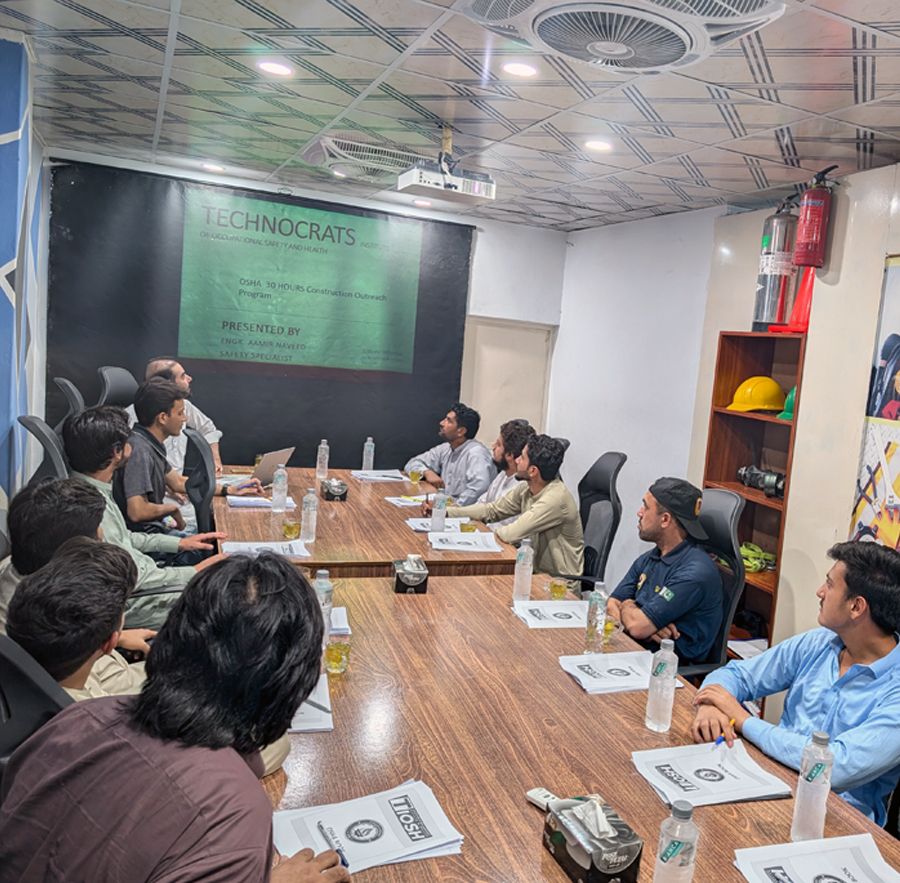 Technocrats Training Institute classroom session with students gathered around a training table
